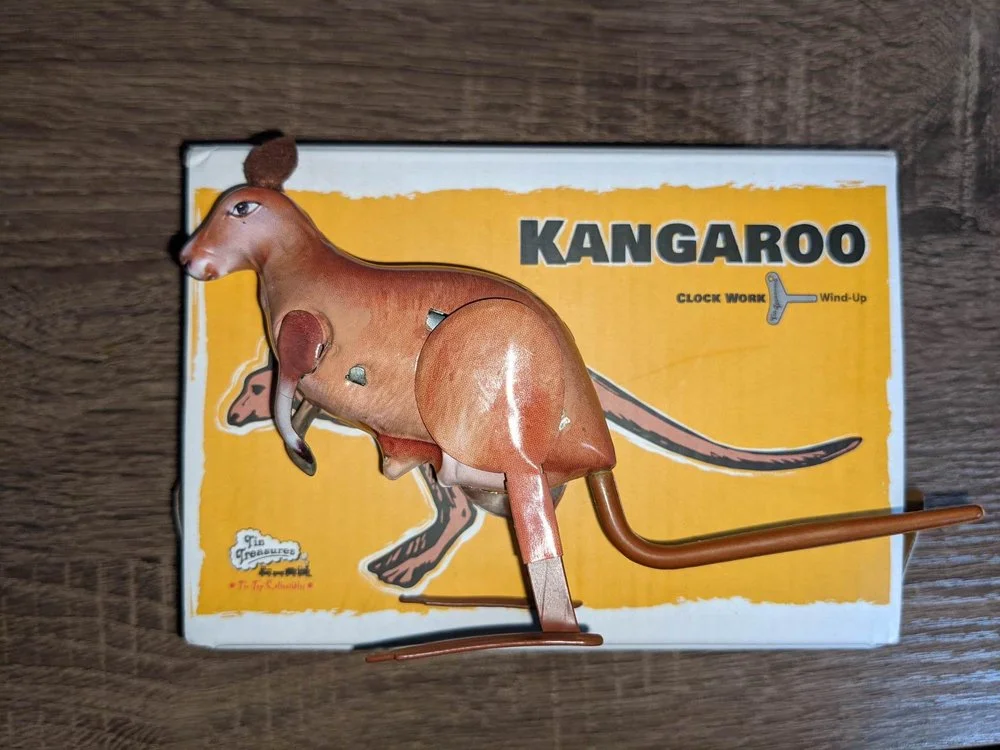 The wind-up toy kangaroo featured throughout the work.