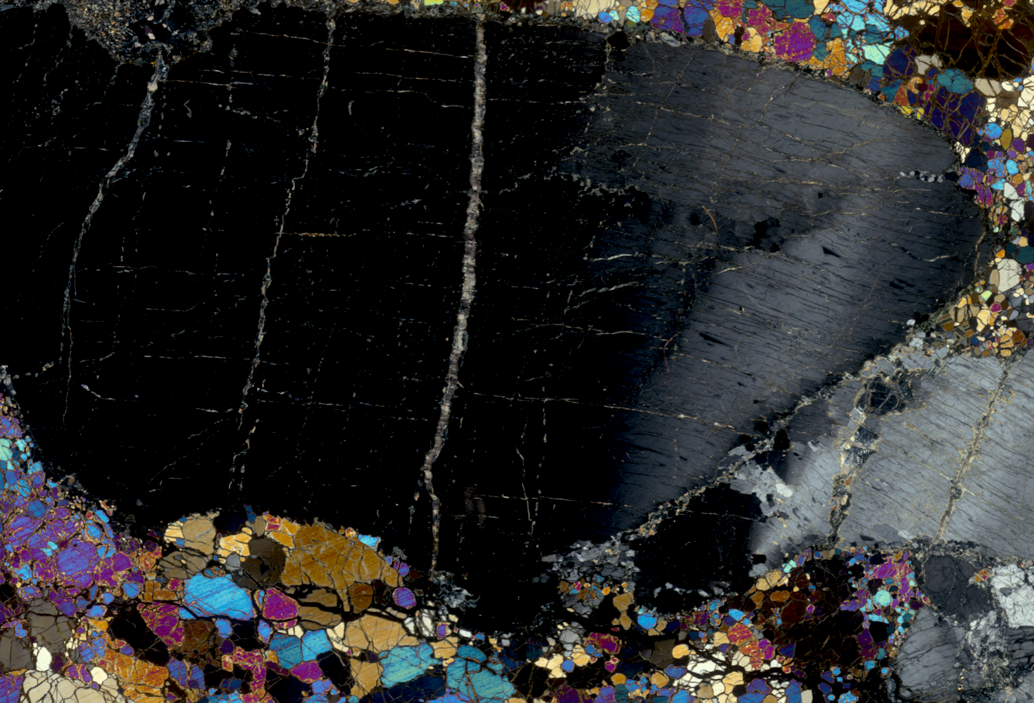 Photomicrographic image of a thin rock section from the Earth’s mantle used in the scrolling score for Reading Mantle Petrology.